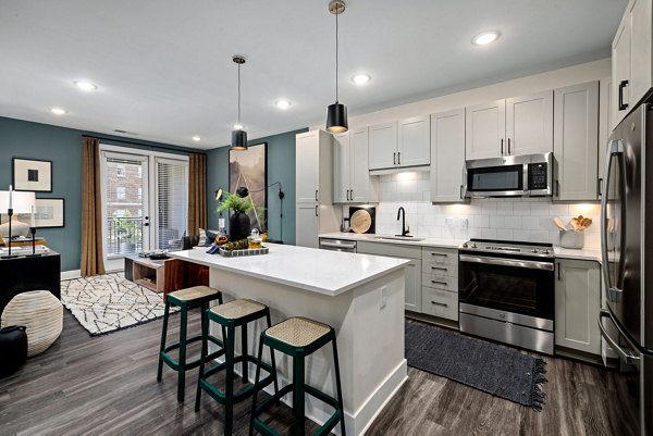 Modern kitchen featuring stainless steel appliances at The Signal Apartments, a Greystar luxury living community