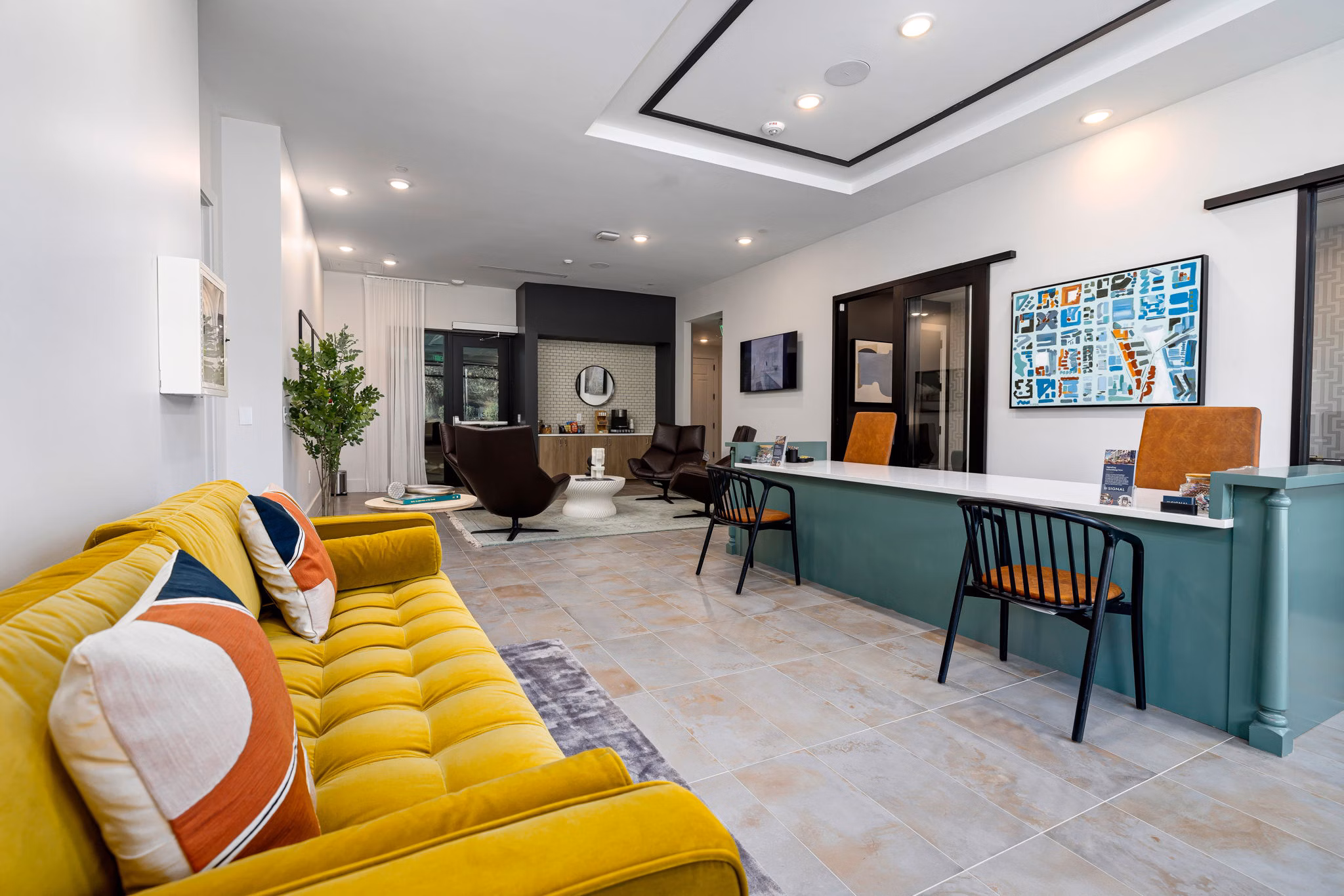 Cozy living room with modern furnishings at The Signal Apartments, featuring plush seating and stylish decor perfect for relaxation