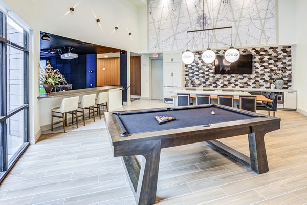 clubhouse game room at The Huntley Apartments