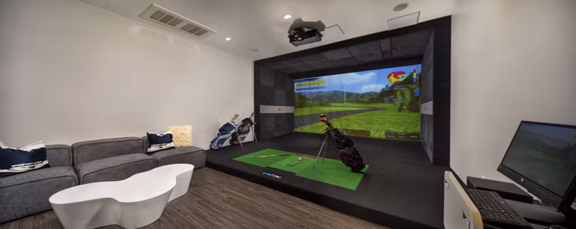 Game room with modern entertainment setups at Next on Lex Apartments in Glendale