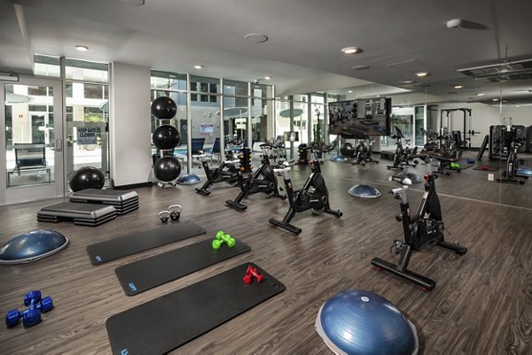 Fitness center with modern equipment at Next on Lex Apartments