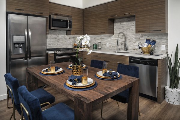 Modern kitchen with stainless steel appliances at Next on Lex Apartments in Glendale