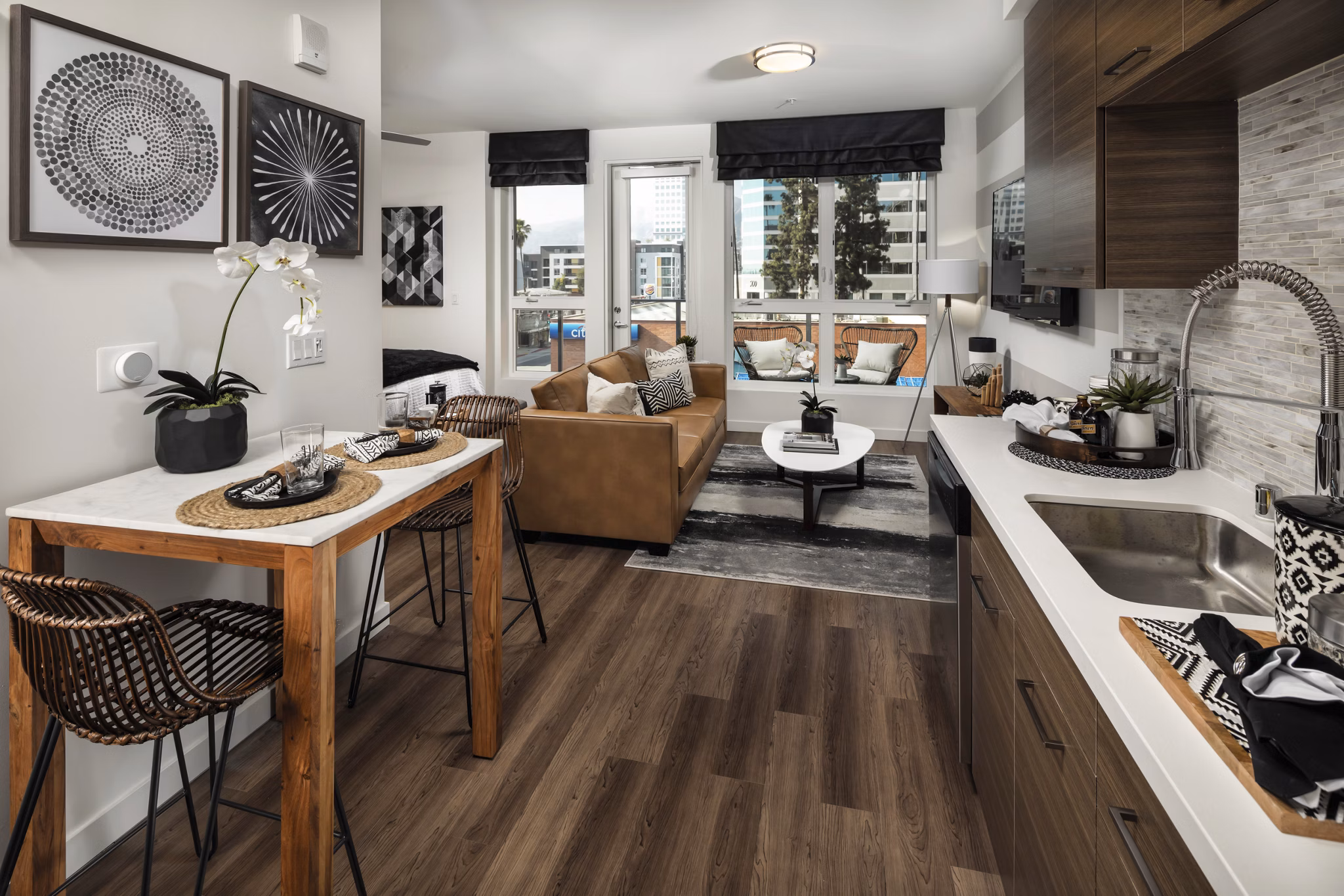 Modern kitchen with stainless steel appliances and island countertop at Next on Lex Apartments, ideal for luxury living in Glendale