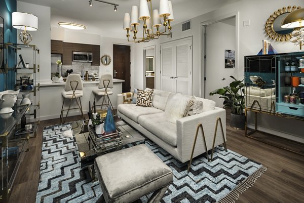 Living room with modern furnishings and city views at Next on Lex Apartments, luxury living in Glendale