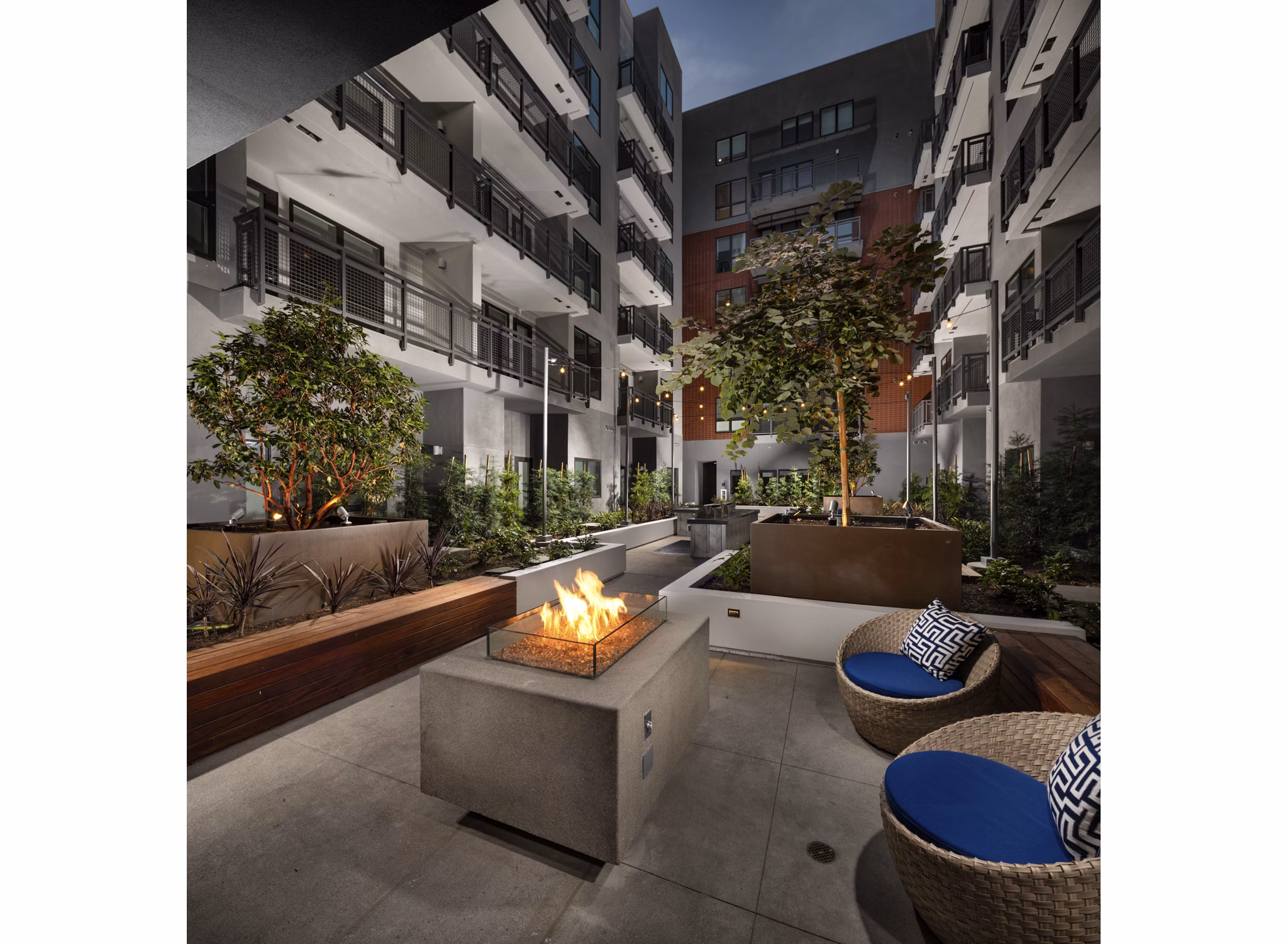 Fire pit with cozy seating area at Next on Lex Apartments, a luxury property by Greystar