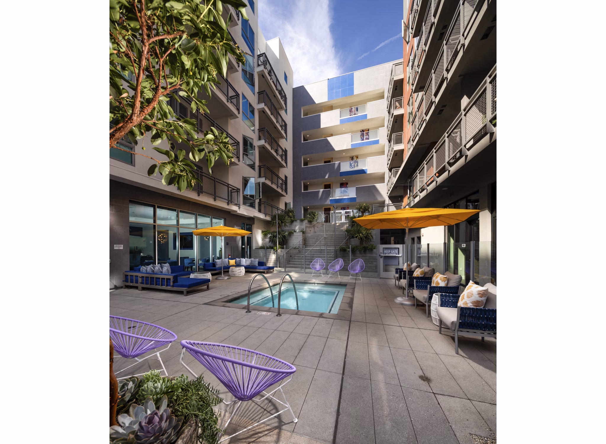 Tranquil courtyard with lush greenery at Next on Lex Apartments, offering luxury living in the heart of Glendale