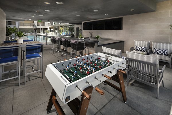Spacious outdoor patio with modern seating at Next on Lex Apartments in Glendale, offering relaxed alfresco living