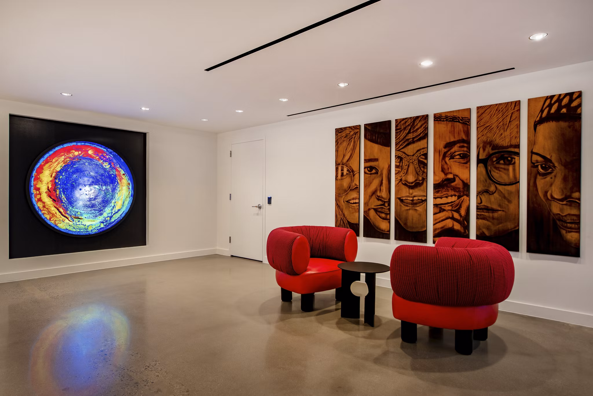 Clubhouse featuring modern design and seating at Gallery 64 Apartments in a vibrant urban setting