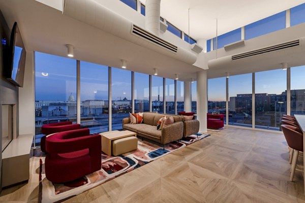 Modern clubhouse with stylish seating and decor at Gallery 64 Apartments