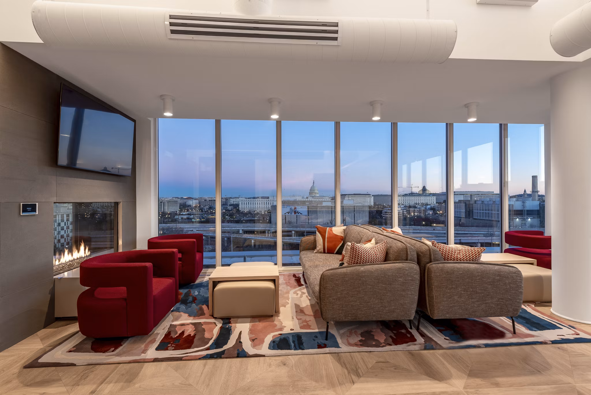 Community space featuring a stylish clubhouse at Gallery 64 Apartments with modern furnishings and social areas