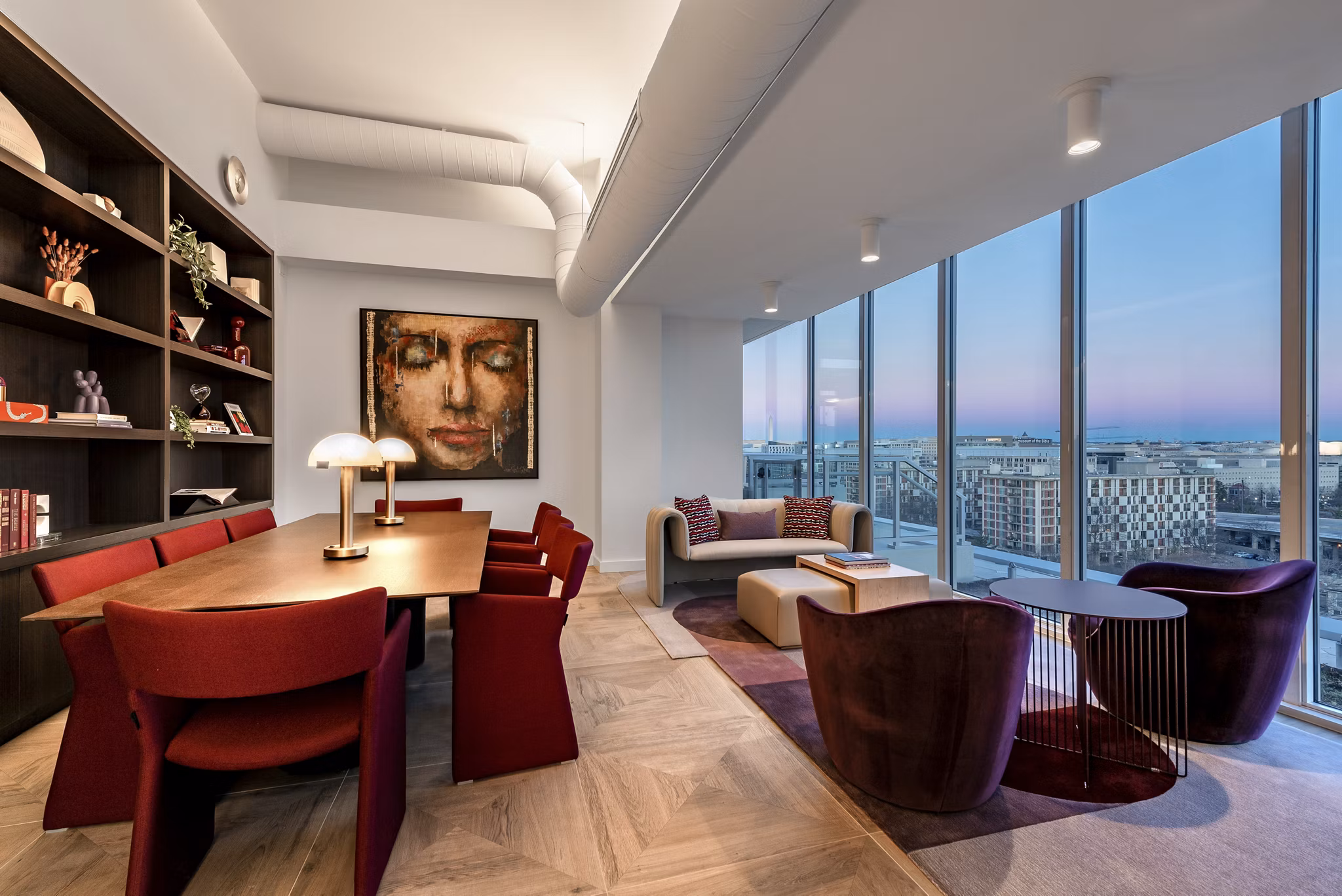 Clubhouse with modern furnishings and vibrant decor at Gallery 64 Apartments