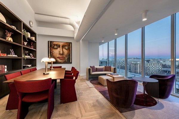 Clubhouse with modern furnishings and vibrant decor at Gallery 64 Apartments