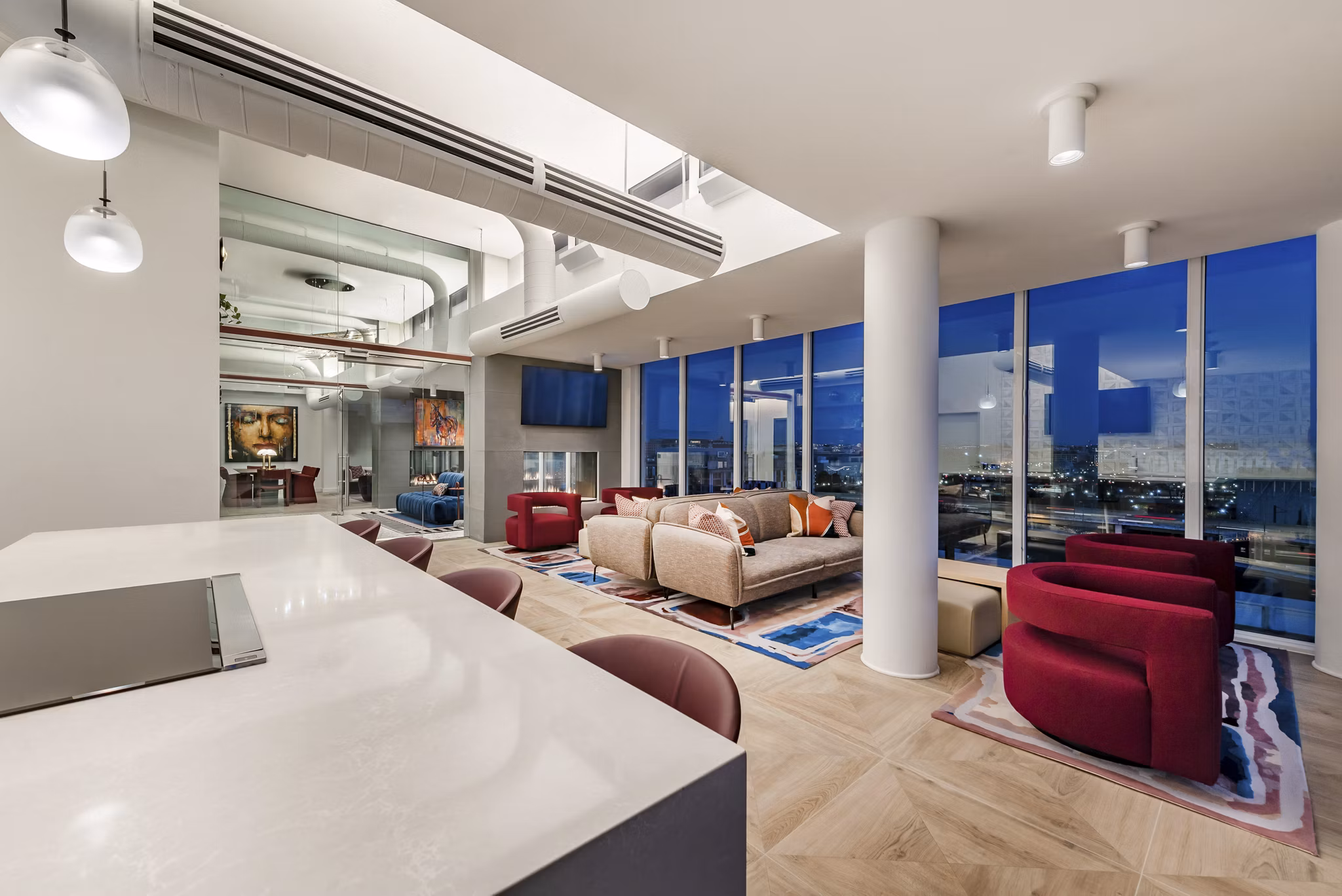 Clubhouse lounge with modern decor and spacious seating at Gallery 64 Apartments
