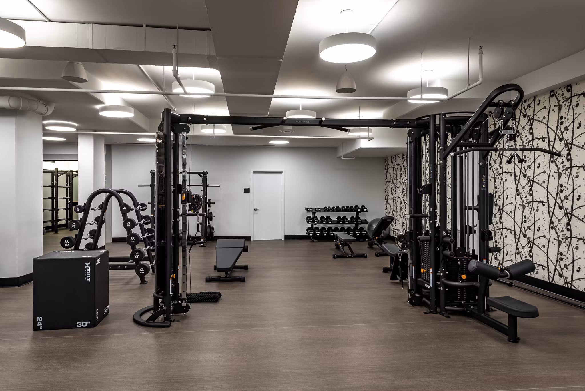 Modern fitness center with state-of-the-art equipment at Greystar's Gallery 64 apartments