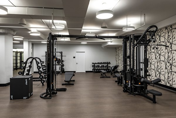 Modern fitness center with state-of-the-art equipment at Greystar's Gallery 64 apartments