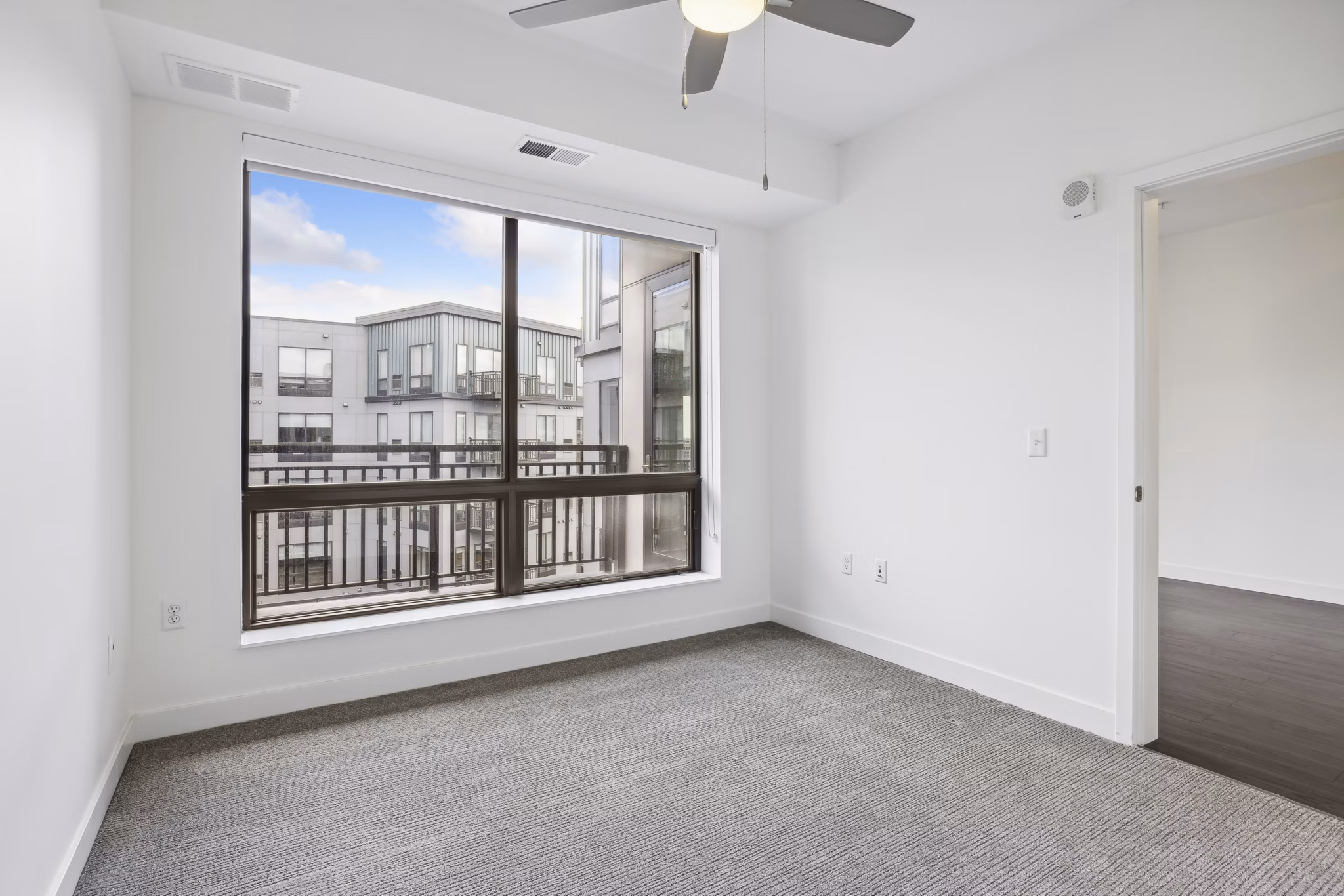 Bedroom featuring contemporary decor and natural light at Avidor Edina Apartments