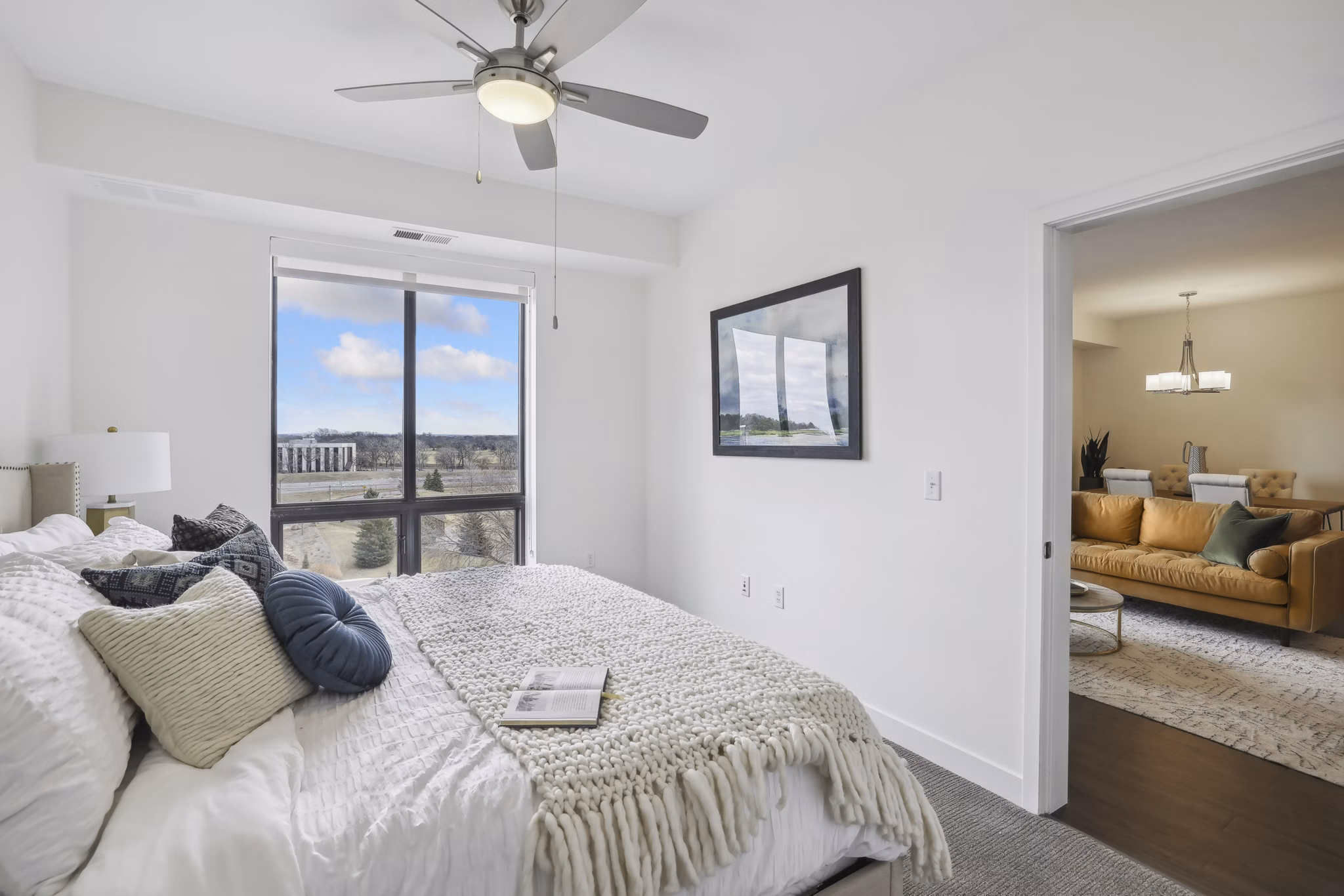 Bedroom featuring contemporary design with plush bedding at Avidor Edina Apartments - luxury living for seniors