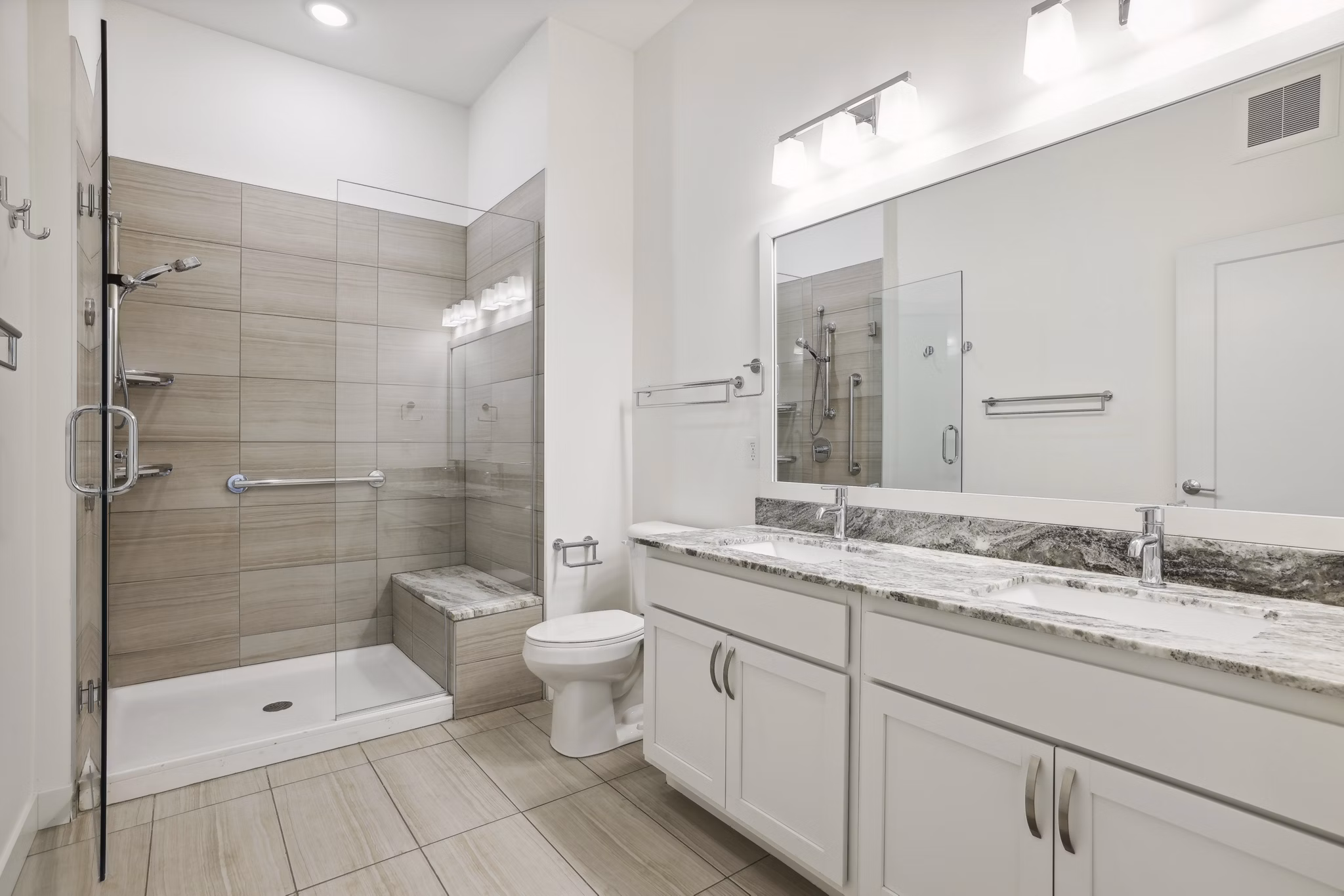 Bathroom featuring modern fixtures at Avidor Edina Apartments