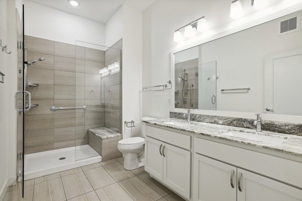 Bathroom featuring modern fixtures at Avidor Edina Apartments