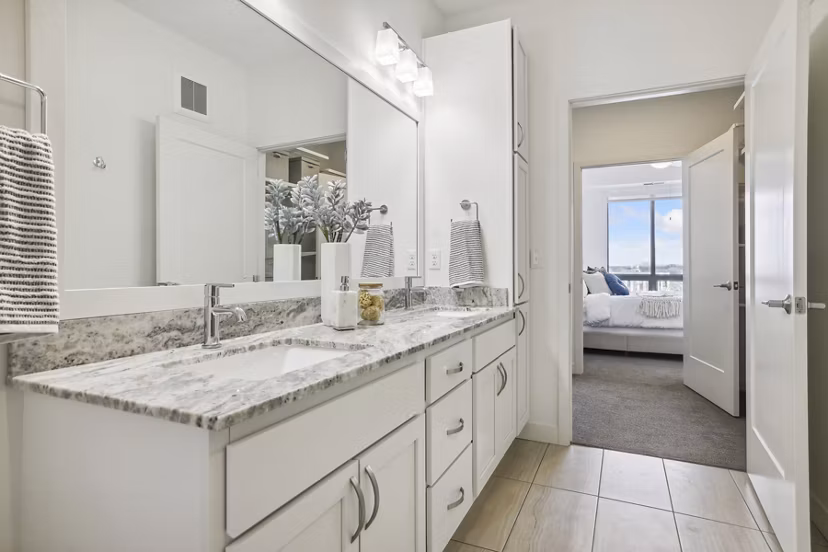 Elegant bathroom with modern fixtures at Avidor Edina Apartments, offering luxury living and sophisticated design features
