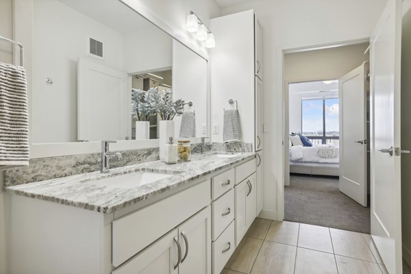 Elegant bathroom with modern fixtures at Avidor Edina Apartments, offering luxury living and sophisticated design features