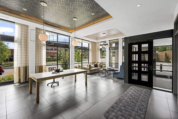 Elegant clubhouse with modern decor at Avidor Edina Apartments, perfect for social gatherings and leisure activities