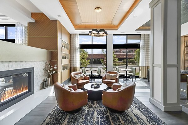 Clubhouse featuring modern design and spacious seating at Avidor Edina Apartments, luxury living by Greystar