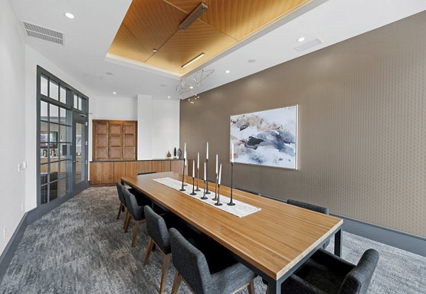 Clubhouse with modern decor and social seating at Avidor Edina Apartments, a luxury living community Ideal for gatherings and relaxation