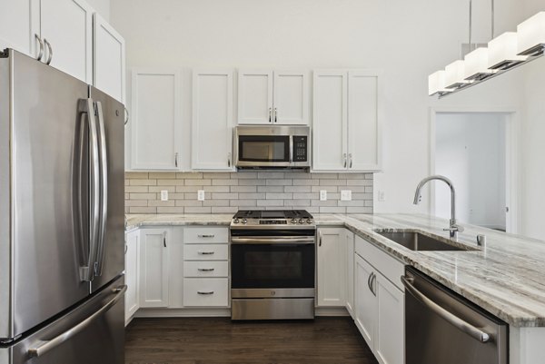 Modern kitchen with stainless steel appliances in Avidor Edina Apartments, luxury living near Minneapolis
