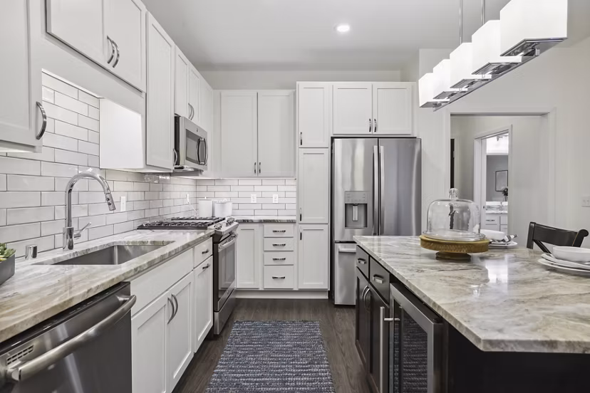 Modern kitchen with stainless steel appliances at Avidor Edina Apartments, a luxury community for stylish living in Edina