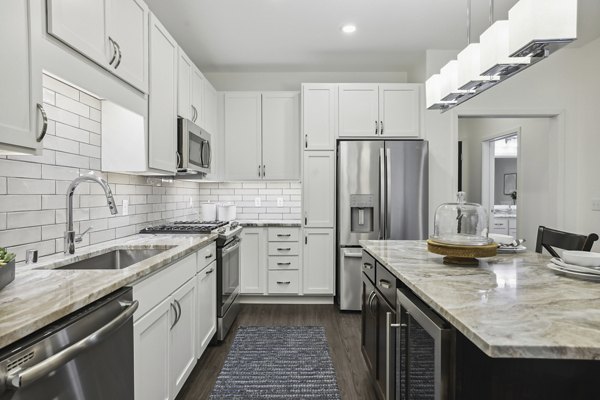 Modern kitchen with stainless steel appliances at Avidor Edina Apartments, a luxury community for stylish living in Edina