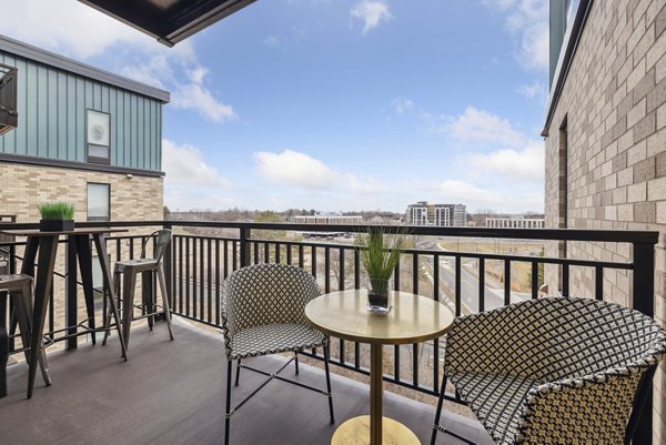 Scenic patio with modern seating at Avidor Edina Apartments offering luxury living experience