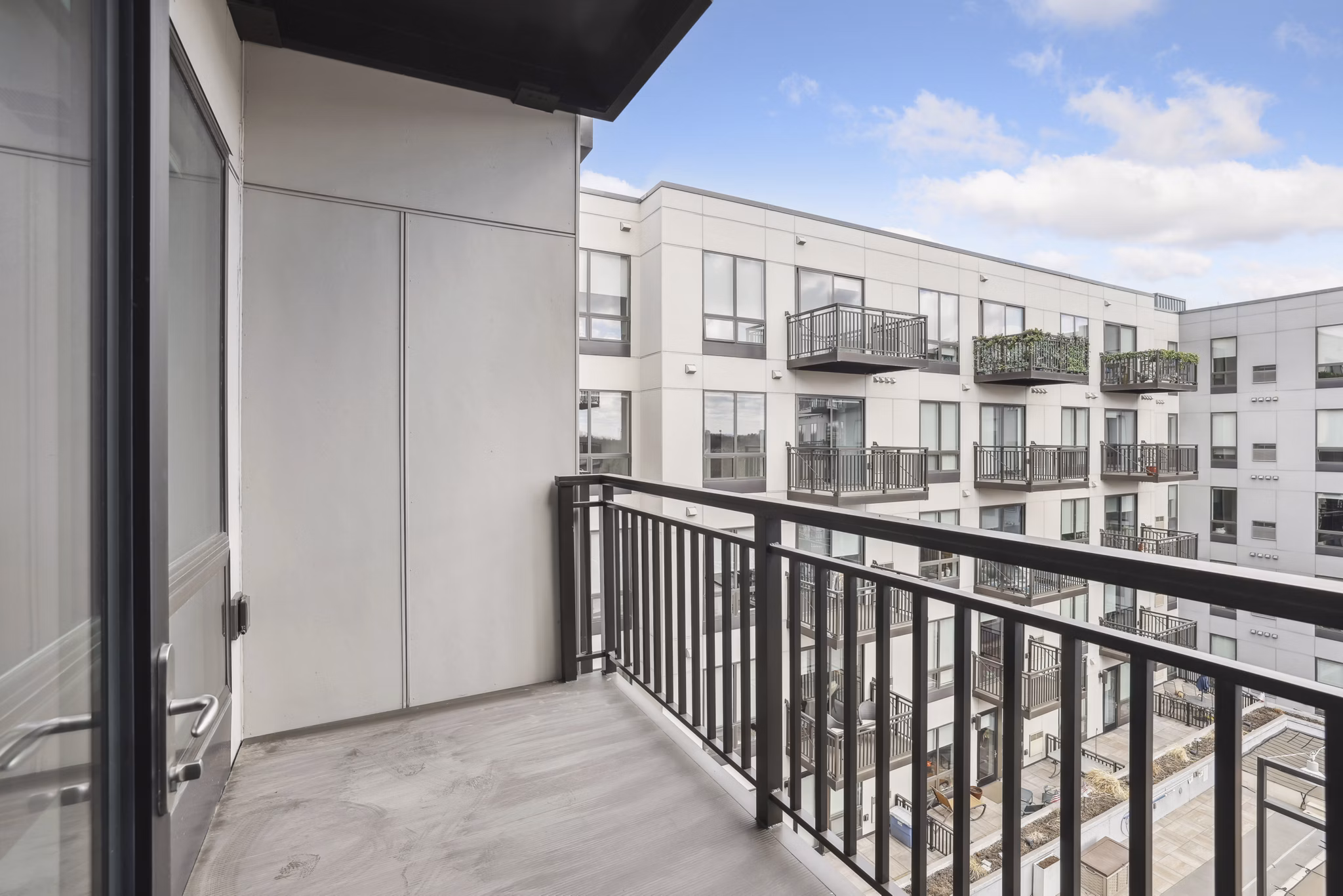 Cozy outdoor seating area on the patio at Avidor Edina Apartments