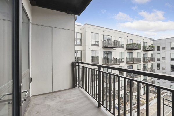 Cozy outdoor seating area on the patio at Avidor Edina Apartments