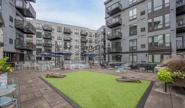 Charming courtyard with lush greenery at Avidor Edina Apartments