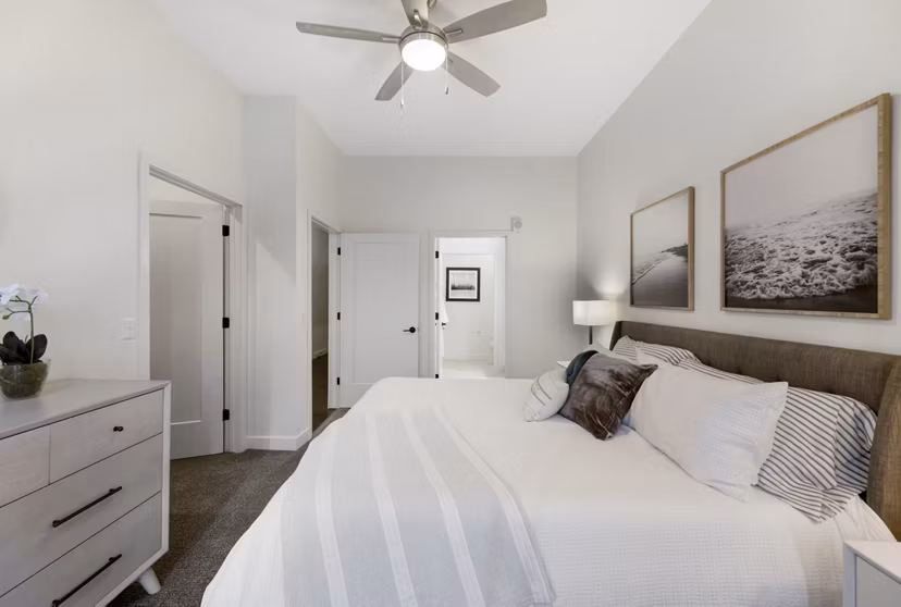 Bedroom featuring modern decor and natural lighting at Avidor Minnetonka Apartments