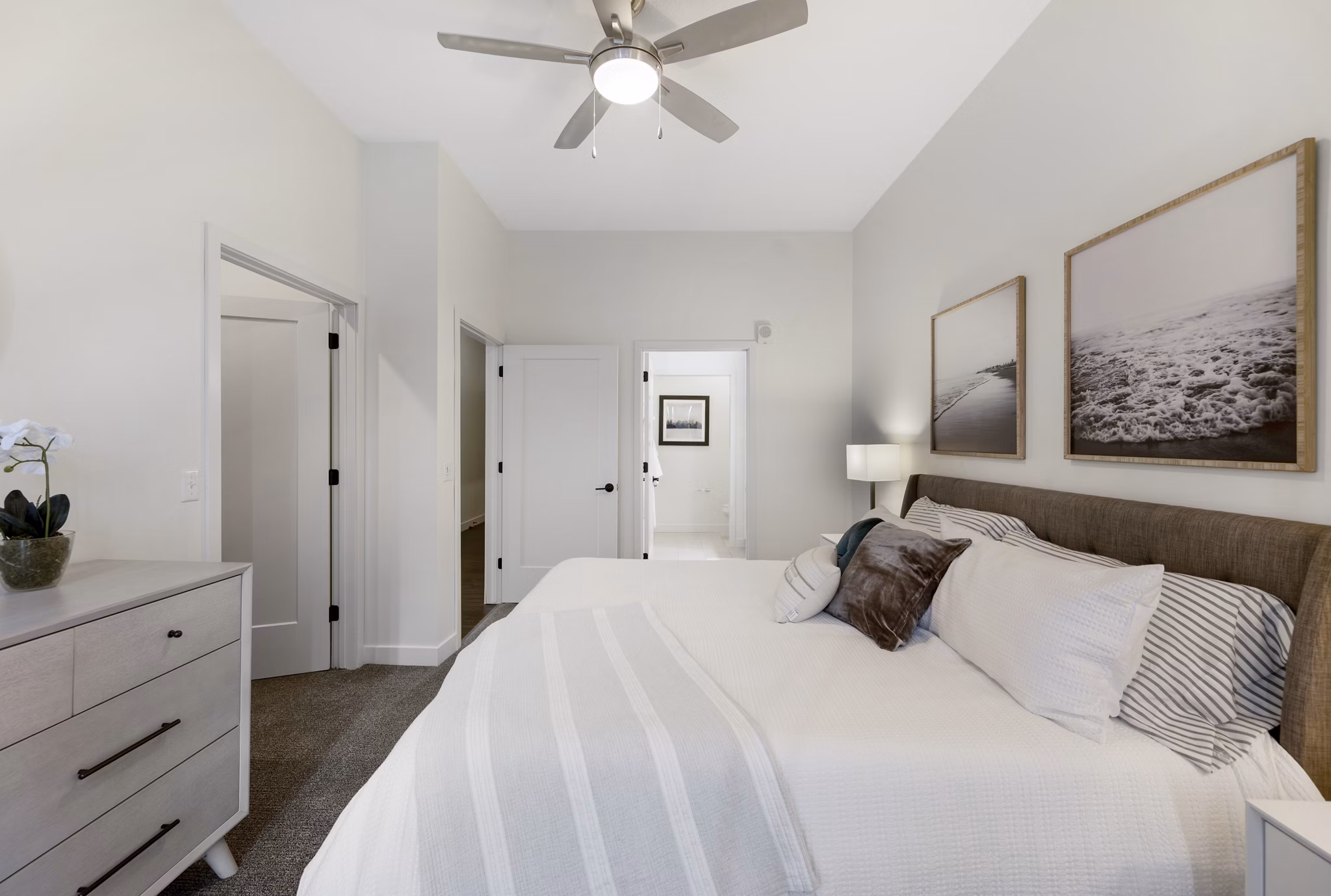 Bedroom featuring modern decor and natural lighting at Avidor Minnetonka Apartments