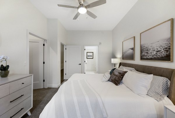 Bedroom featuring modern decor and natural lighting at Avidor Minnetonka Apartments