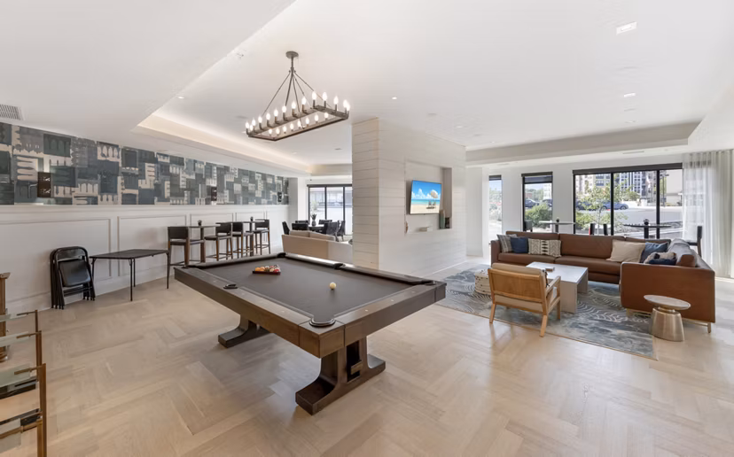 Game room with billiards and lounge area at Avidor Minnetonka Apartments, offering leisure and socializing spaces for residents in luxury living