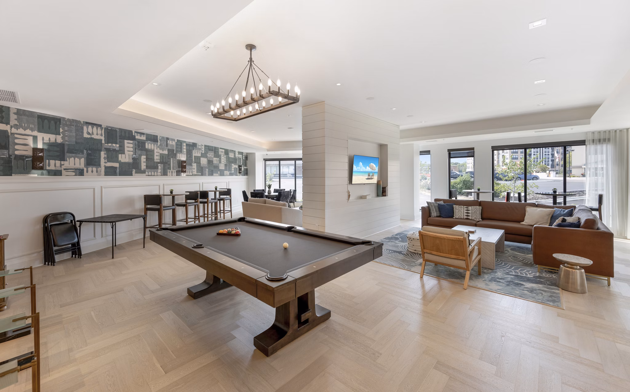 Game room with billiards and lounge area at Avidor Minnetonka Apartments, offering leisure and socializing spaces for residents in luxury living