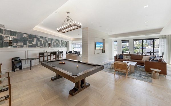 Game room with billiards and lounge area at Avidor Minnetonka Apartments, offering leisure and socializing spaces for residents in luxury living