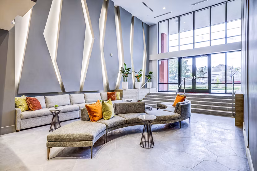 Clubhouse lobby with modern seating and decor at Zoey Apartments, a luxury property by Greystar