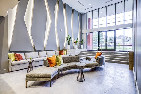 Clubhouse lobby with modern seating and decor at Zoey Apartments, a luxury property by Greystar