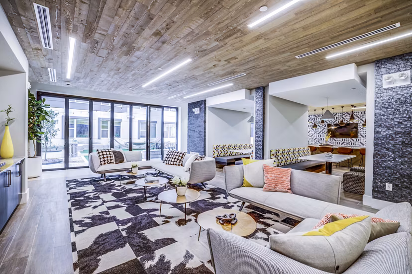 Elegant clubhouse lobby with contemporary furnishings at Zoey Apartments
