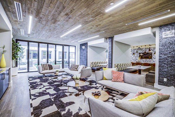 Elegant clubhouse lobby with contemporary furnishings at Zoey Apartments