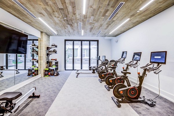 Spin studio featuring state-of-the-art bikes and yoga space at Zoey Apartments Ideal for fitness enthusiasts seeking luxury at Greystar properties