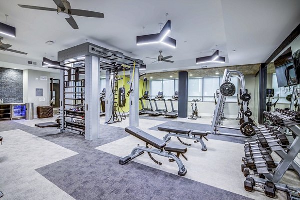 State-of-the-art fitness center featuring modern equipment at Zoey Apartments
