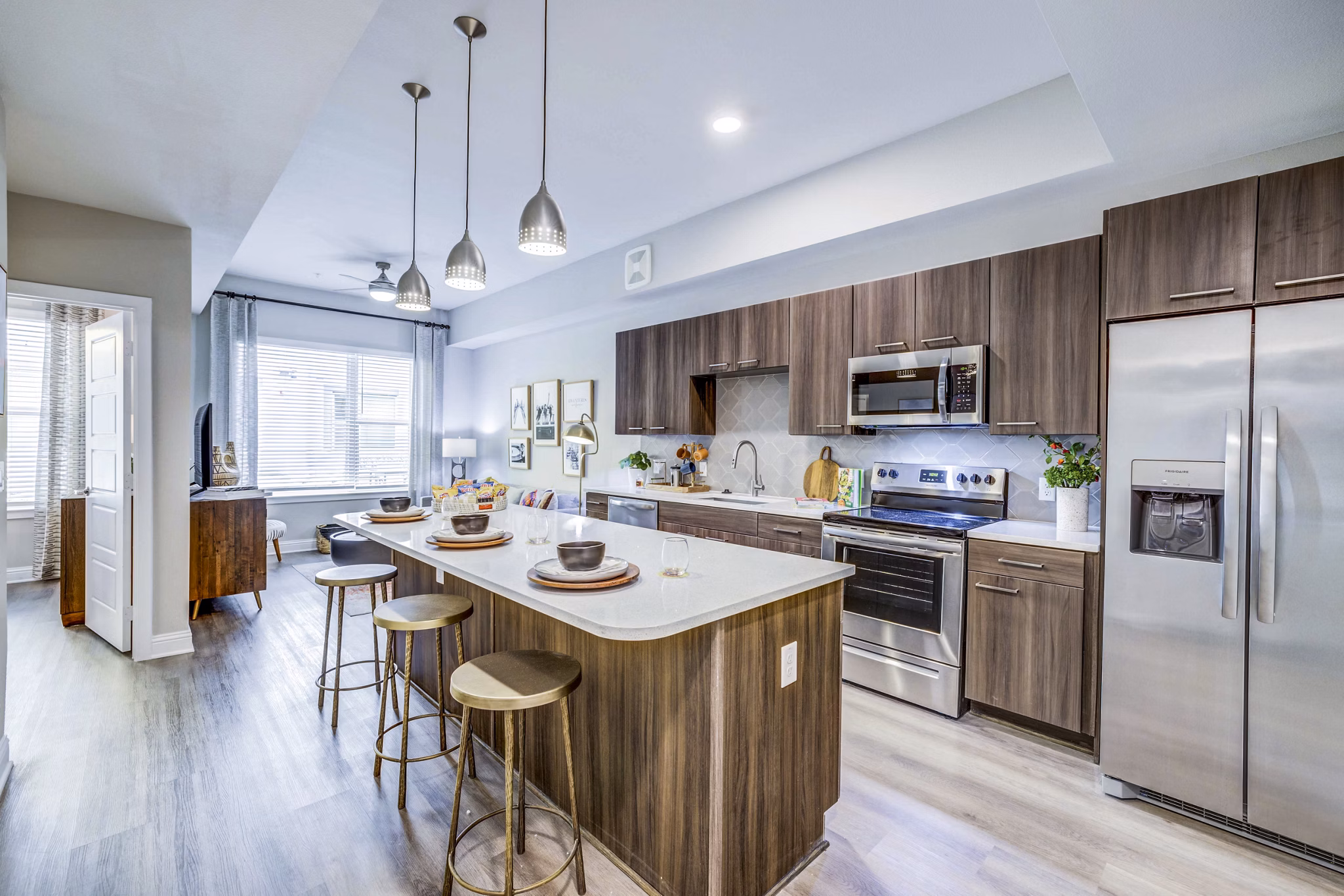 Luxury kitchen featuring stainless steel appliances and granite countertops at Zoey Apartments in vibrant neighborhood