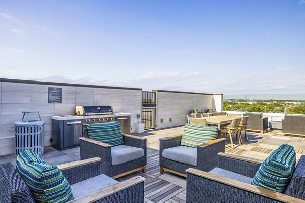 Grill area with modern patio furniture at Zoey Apartments, Greystar luxury apartments