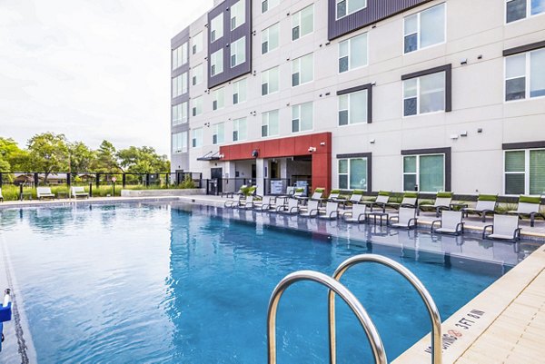 Rooftop pool with skyline views at Zoey Apartments, a luxury living experience